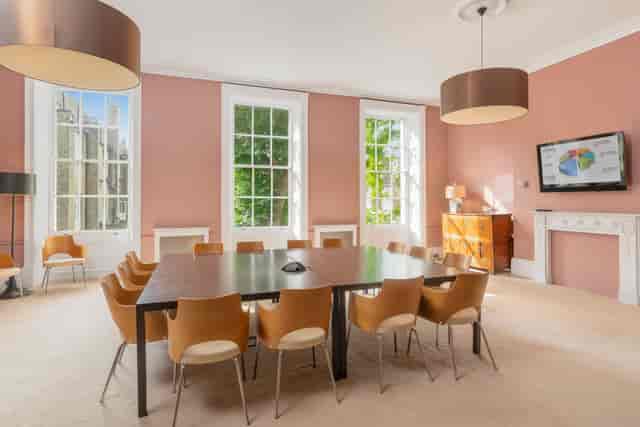 Russell Square Meeting Room with large table, ideal for meetings and brainstorming sessions.