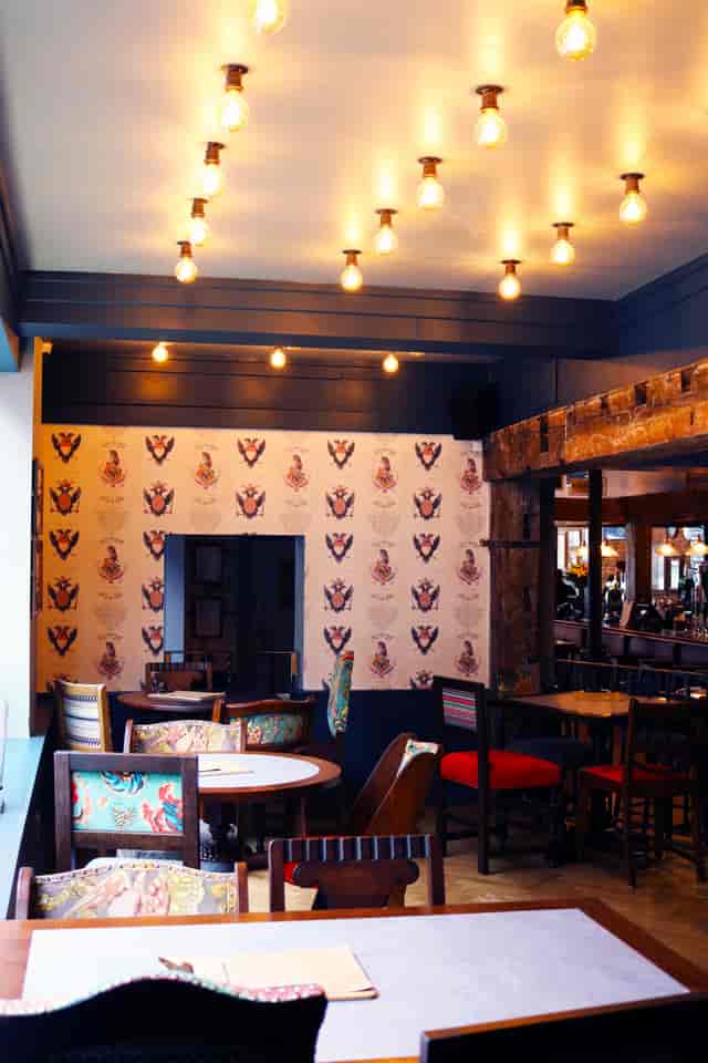 Stylish venue with warm lighting at Millbank Corner, perfect for networking events.