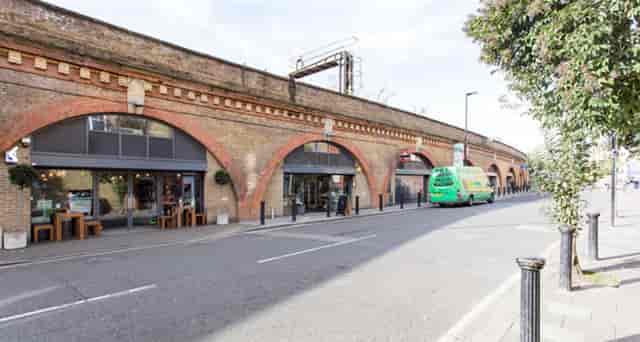 "Arch Cafe in Herne Hill: vibrant venue with arched brick architecture for events"