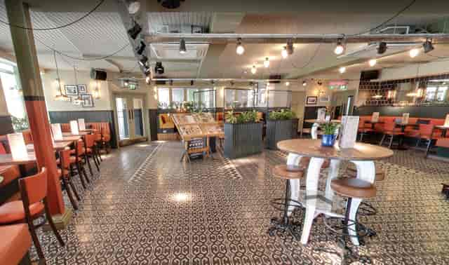 Versatile event space with decorative tile flooring at Revolucion De Cuba Milton Keynes.