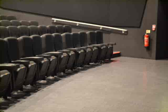 Modern Cineworld Wembley auditorium with black seating for corporate events and screenings.