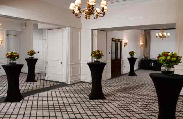 Elegant Farmers Suite event space with floral decor, ideal for networking receptions.