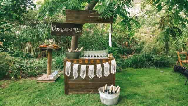 Outdoor champagne bar in Secret River Garden, perfect for weddings and garden parties.