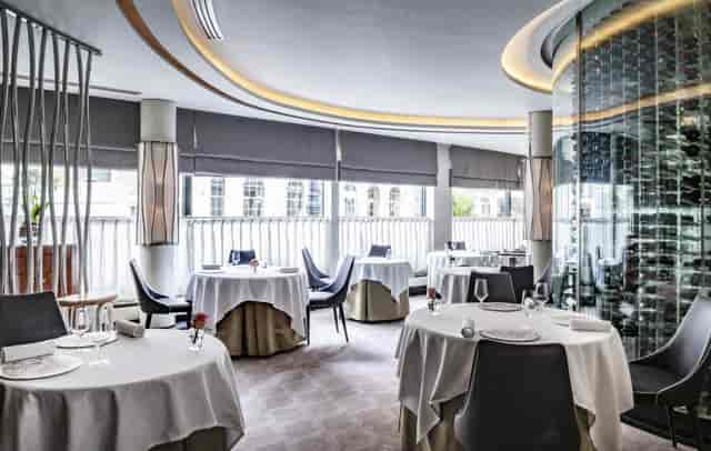 Sophisticated dining space in Petrus for upscale events and private dinners.