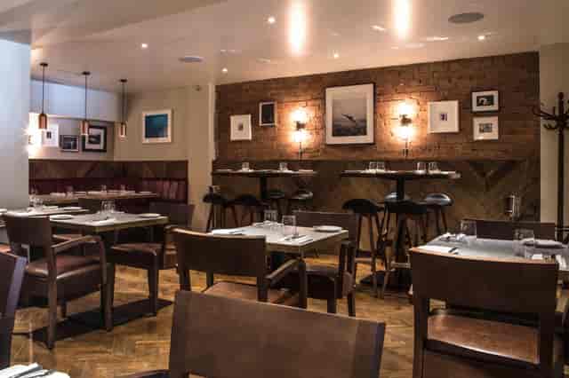Stylish restaurant setting at Gordon Ramsay Bar and Grill for intimate events and gatherings.