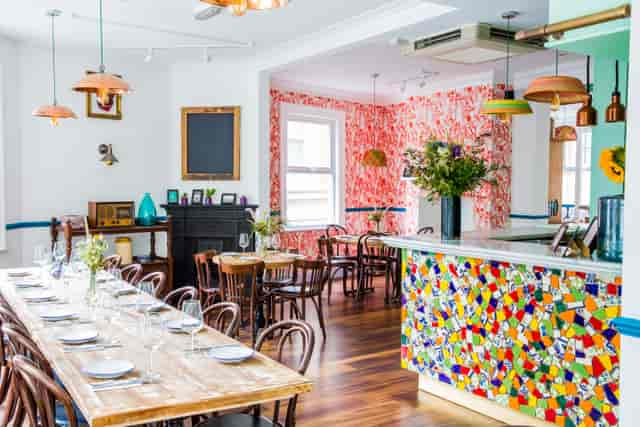 Tequila & Mezcal Bar dining space with vibrant decor for intimate gatherings and events.