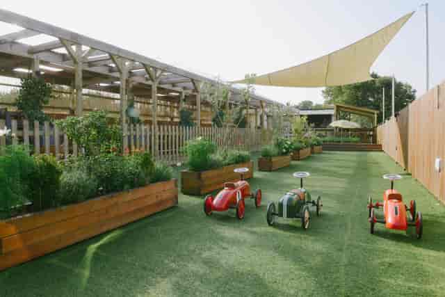 Chiswick Roof Terrace with lush greenery, ideal for family-friendly outdoor events.