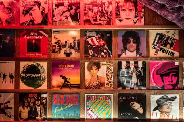 Private karaoke room with vibrant vinyl records for retro music events and networking.