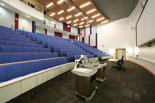 Modern lecture hall with tiered seating for conferences and educational events in Cambridge.