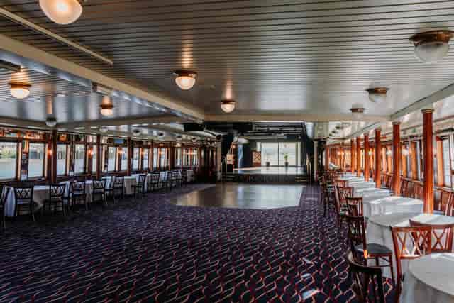 Spacious event venue with elegant decor, ideal for receptions and celebrations.