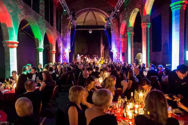 Vibrant gala at Roxy Central with elegantly dressed attendees and live music ambiance.