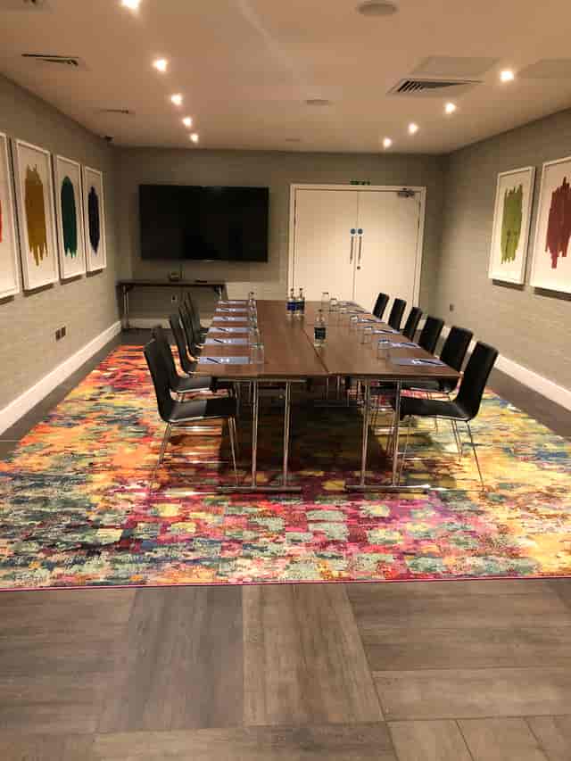 Harbour Suite 3 meeting room with wooden table, ideal for corporate events and presentations.