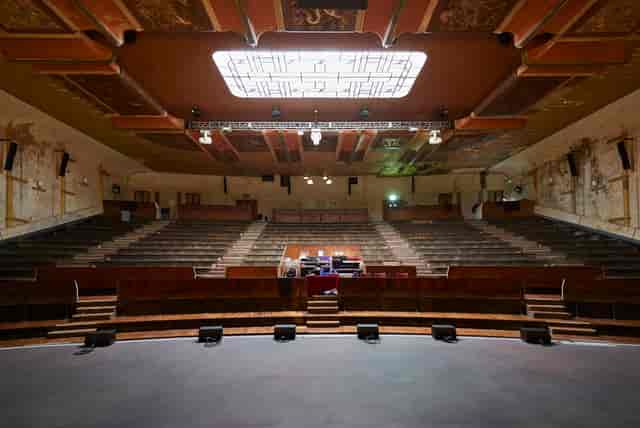 Vintage auditorium with tiered seating, ideal for conferences and performances.