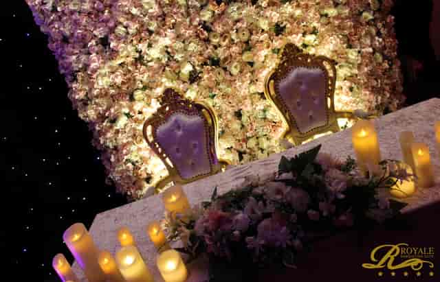 Elegant Silver Suite setup with floral backdrop for weddings and formal events.