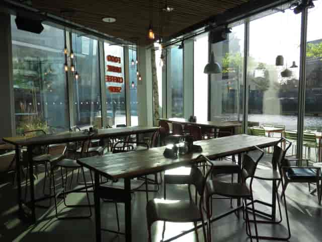 Modern event space at KuPP with large windows, ideal for corporate and social gatherings.