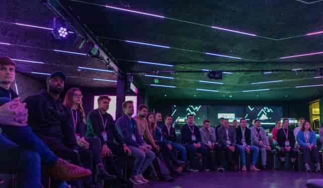 Panel discussion at BeatBox, Boxpark Wembley with engaged audience in modern venue.