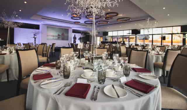 Elegant banquet room at The Owners Club, Newbury Racecourse for corporate events and gala dinners.