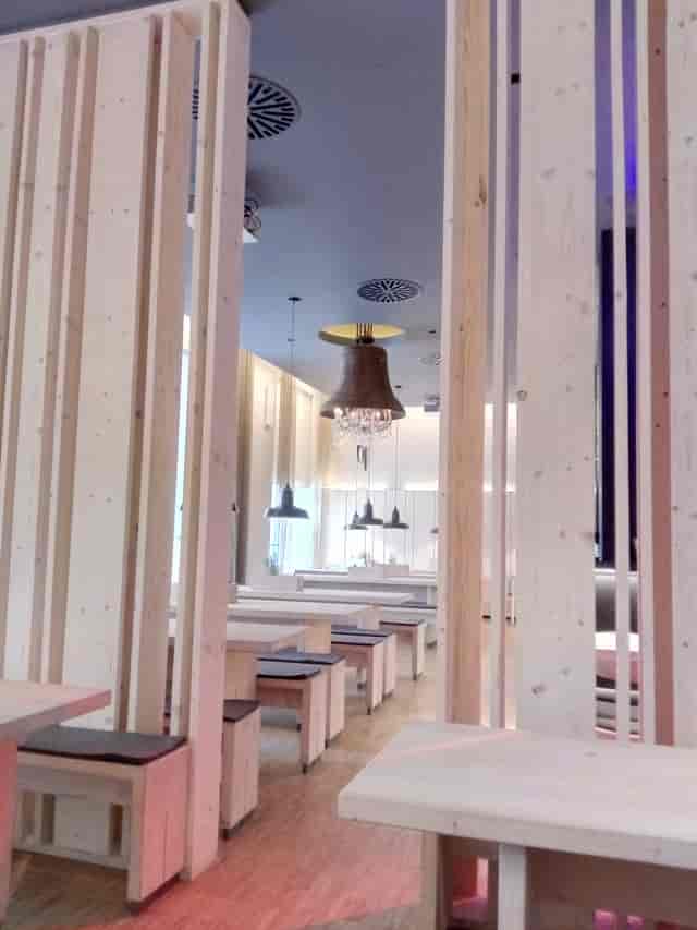 Modern event space with wood accents at Stein's Berlin Restaurant for meetings and gatherings.