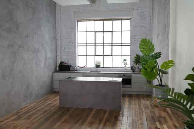 Modern minimalist kitchen with natural light for culinary workshops and networking events.