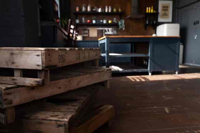 Crixus Dockyard Kitchen: rustic event space with wooden pallets for gatherings and catering.