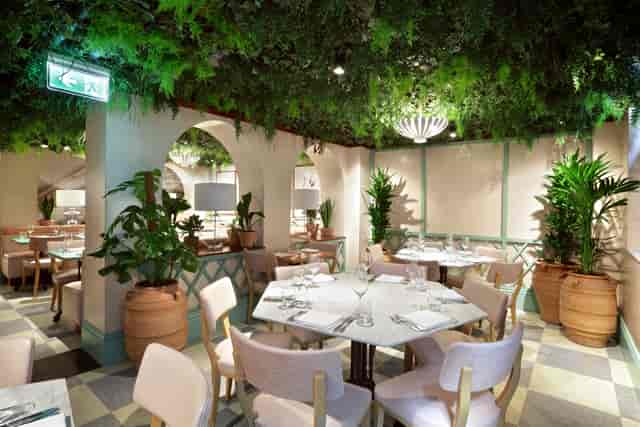 Elegant Garden Room at Kanishka Mayfair, ideal for upscale events and intimate gatherings.