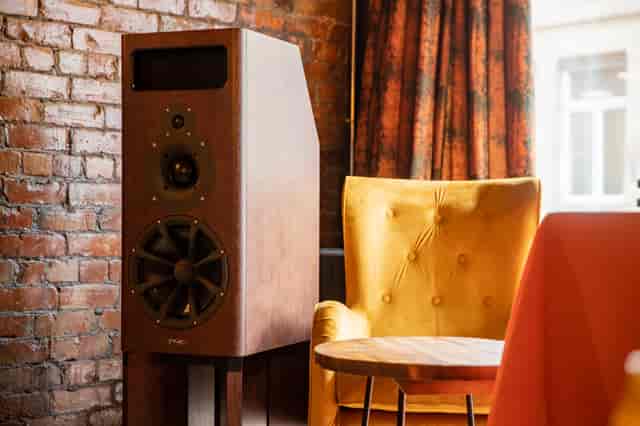 Stylish audio speaker and cozy armchair in a creative meeting space at 33 Oldham Street.