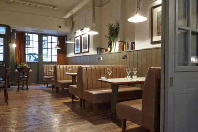 Cozy Map Room at Dalys Wine Bar, perfect for intimate meetings and small events.