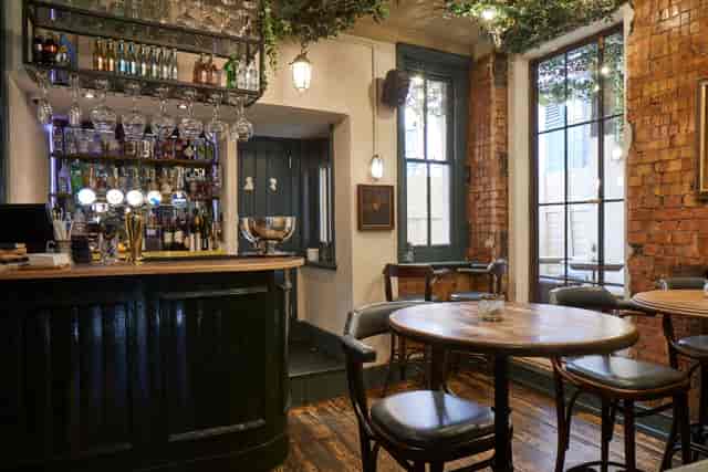 Cozy Gin Terrace at Bow Street Tavern, ideal for networking events and gatherings.