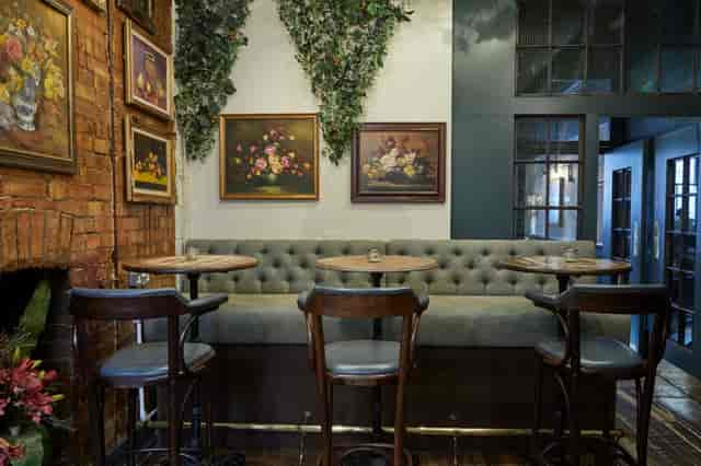 Cozy Gin Terrace seating area with plush decor for networking events and meetings.