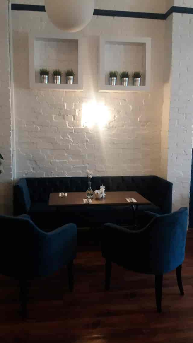 Cozy dining setup in Stella's Room, ideal for private events and team-building activities.