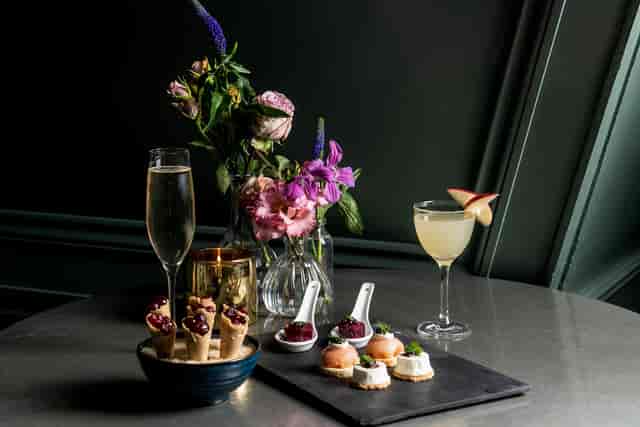 Elegant Balcony Room setup with hors d'oeuvres for upscale networking events.