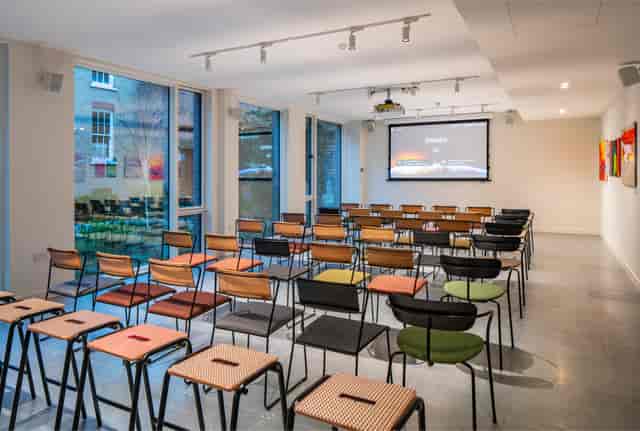 Versatile meeting space in People's Mission Hall for corporate events and workshops.