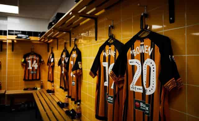 MKM Stadium locker room showcasing team jerseys for sports events and branding.
