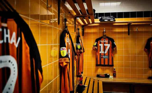 Vibrant MKM Stadium locker room, ideal for team-building events and workshops.