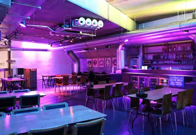 Modern event space at The Platform, Mamuśka! with purple lighting for gatherings.