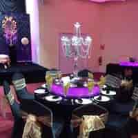 Elegant banquet table with chandelier at Praba Banqueting Suite for weddings and corporate events.