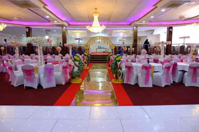 Elegant Praba Banqueting Suite with pink accents, ideal for weddings and formal events.