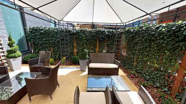 Stylish outdoor lounge at DoubleTree London, perfect for networking events and meetings.