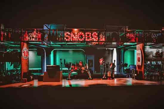VIP Mezzanine Suite bar setup with dynamic lighting for events and gatherings.