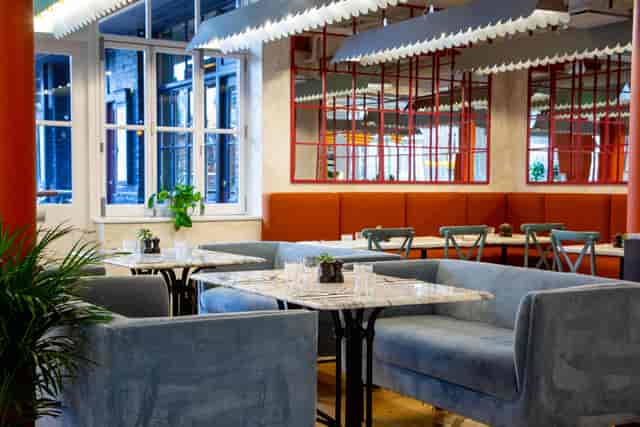 Modern event space with plush seating and natural light in Paradiso Soho.
