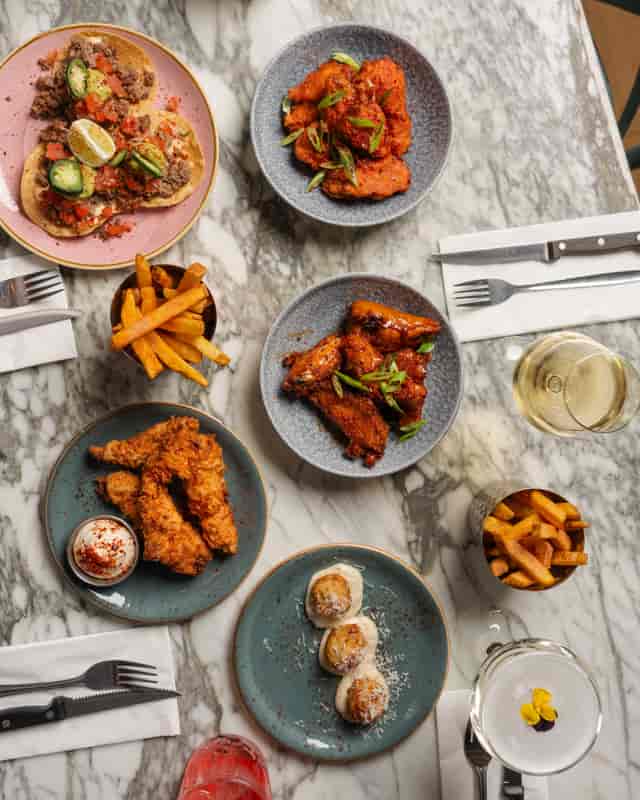 Vibrant food spread on marble tables for casual networking and team-building events.