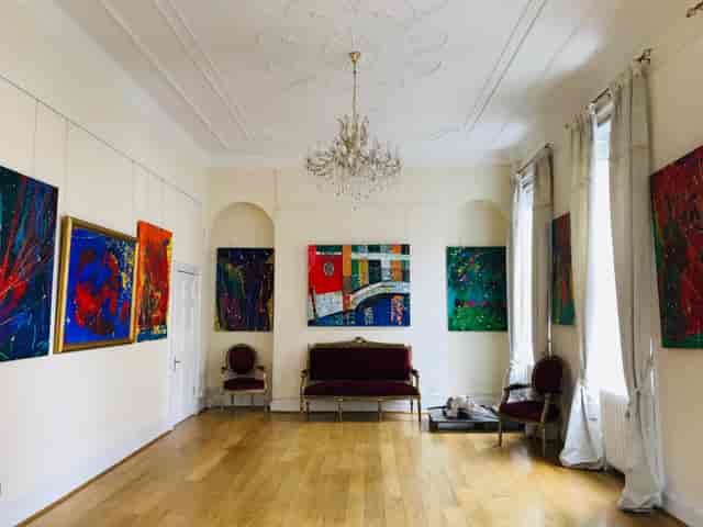 Grand Hall at Ratiu Family Foundation with elegant chandelier, perfect for art exhibitions and events.
