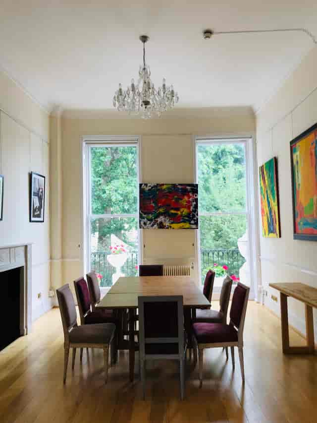 Bright Grand Hall with large windows, perfect for workshops and meetings.