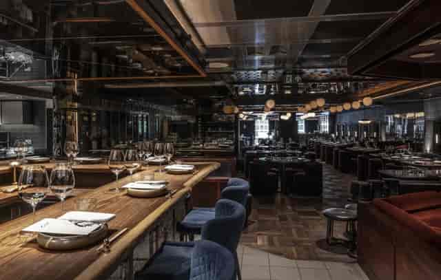 Sophisticated kitchen table in Lucky Cat, ideal for upscale events and gatherings.