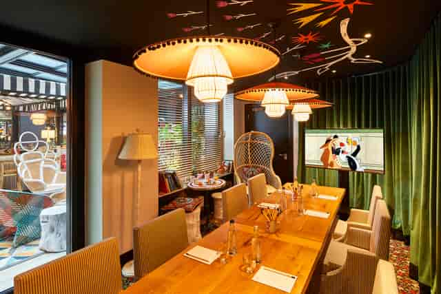 Private dining room at Mama Shelter London, featuring a long wooden table for meetings.