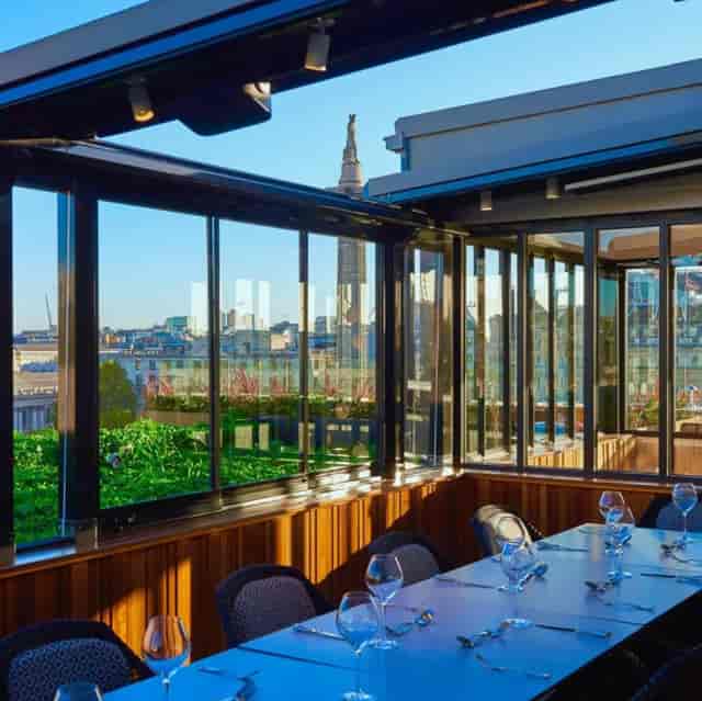 Stylish event space with skyline views, ideal for corporate meetings and social gatherings.