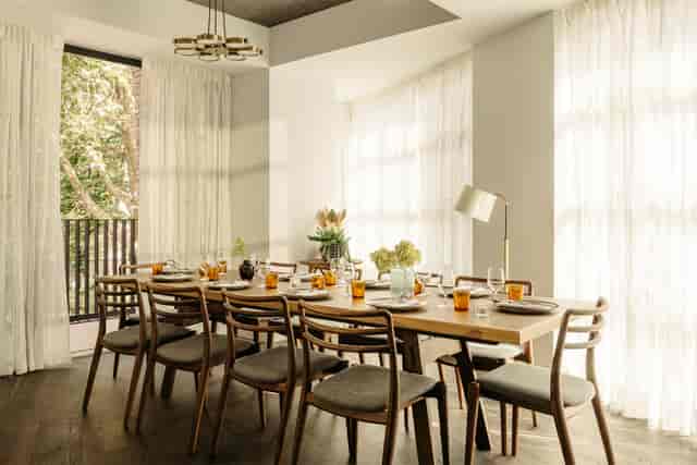 Elegant meeting space with wooden table, ideal for corporate retreats and networking events.