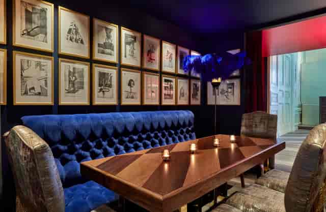 Stylish meeting space with blue banquette at Andaz London, ideal for corporate events.