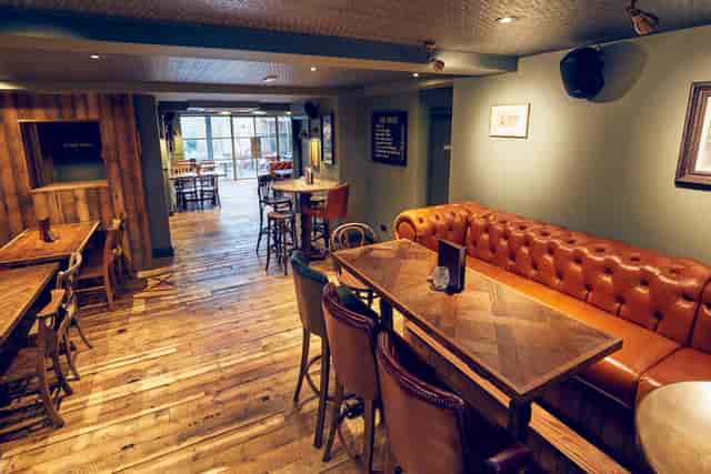 Versatile event space in East Putney Tavern with cozy seating for gatherings and meetings.