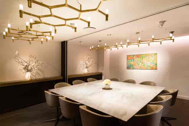 Modern meeting room with marble table at All Event Spaces, ideal for corporate gatherings.